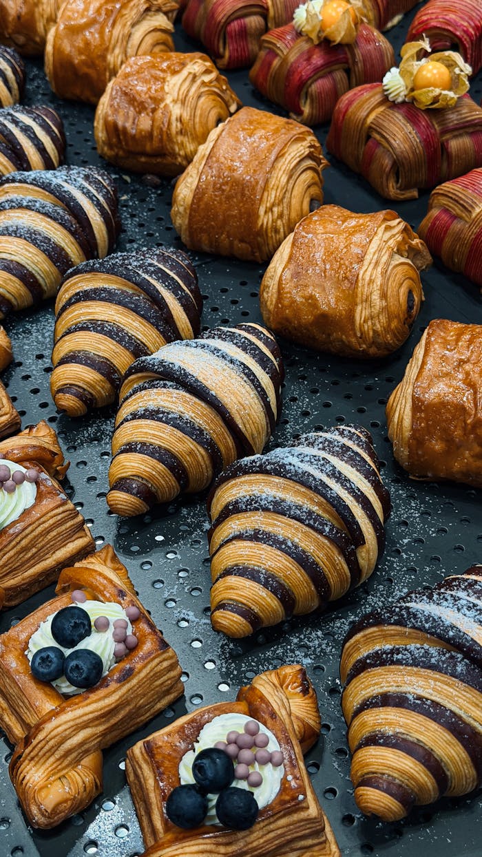 Colorful assortment of pastries and croissants in a bakery in Ho Chi Minh City, Vietnam.